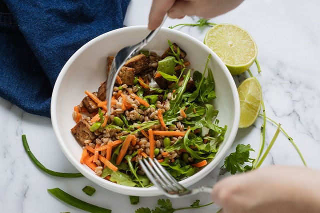 mixing tofu bowl